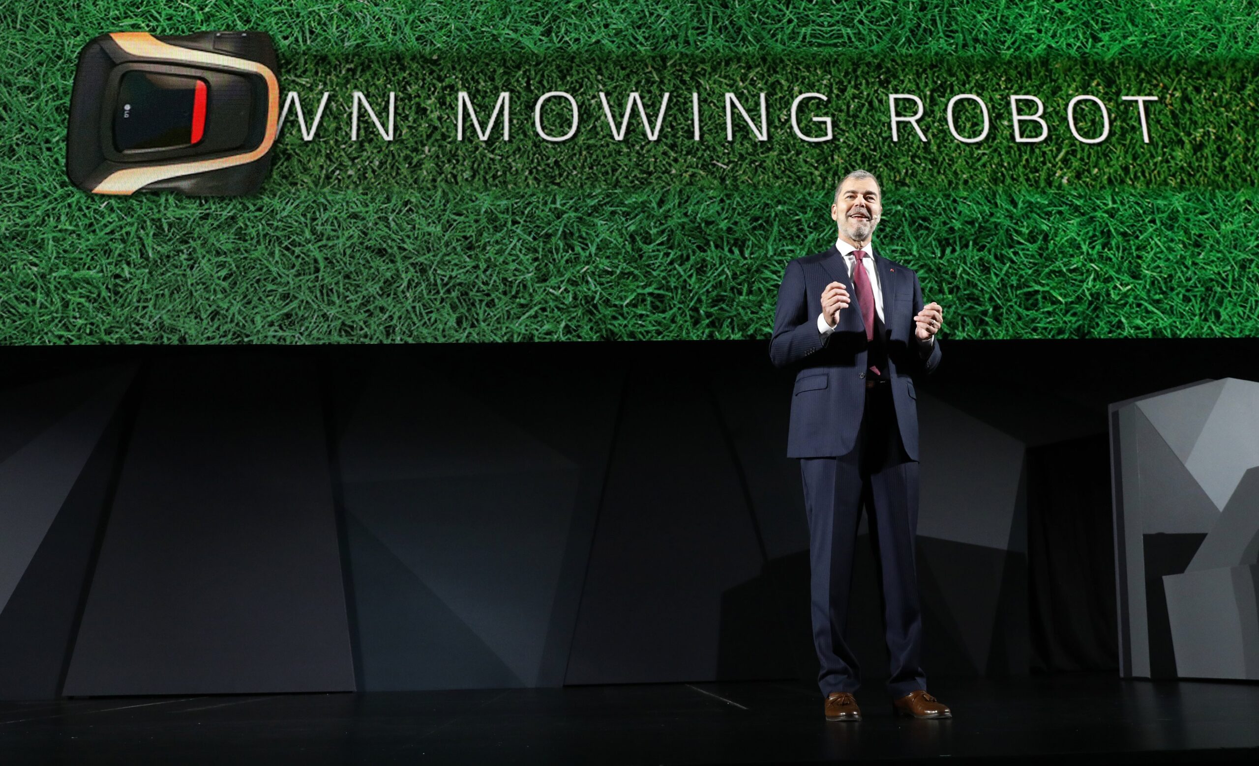 David VanderWaal, Senior Vice President, Marketing, LG Electronics introduces the LG Lawn Mowing Robot during the LG Press Conference at CES 2017.