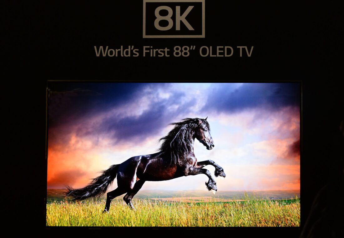 Front close-up view of World’s First 8K OLED TV display at IFA 2018, showing a leaping horse on the screen