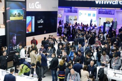 Conference attendees walk around and test out the products at the LG's MWC 2017 booth.