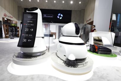 Front view of LG's commercial robots including the Airport Guide Robot, Airport Cleaning Robot and Lawn Mowing Robot at LG's CES 2017 booth