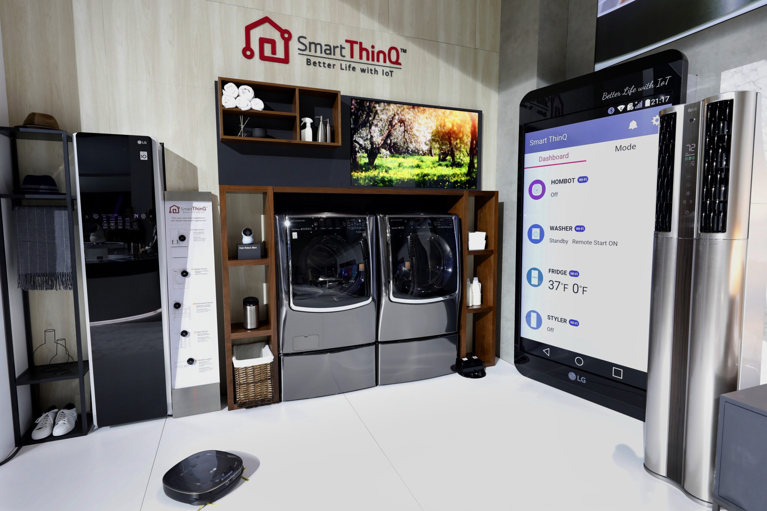 The LG Smart ThinQ zone with LG's AI-powered smart appliances and a large smartphone mock-up to demonstrate how to use an Smart ThinQ app to control appliances