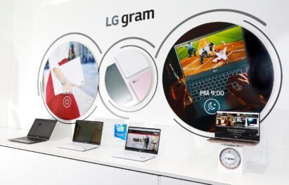 Close view of the LG gram laptop display zone with a model of its lineup being weighed to demonstrate its light weight at the LG display zone at CES 2017