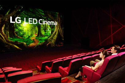 A woman and a man are looking at the LG LED Cinema Display as it produces a colorful nature scene at Showtime Cinemas, Taiwan's leading movie theater company