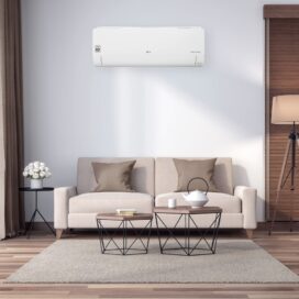 A peaceful living room with an LG air conditioner fitted above the sofa