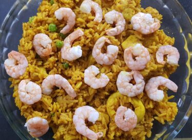 A close-up of the shrimp Paella being prepared