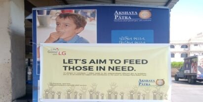 The front shot of a banner reading “Let’s Aim to Feed those in Need”