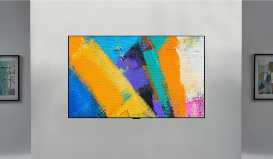 The front shot of the LG GX Gallery TV displaying colorful abstract art