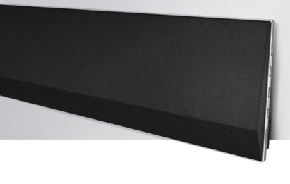 Side view of one end of LG’s GX Soundbar against a wall, providing a closer look of its sturdy steel stand