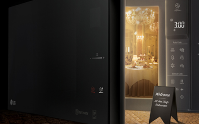 A creative image of the LG NeoChef microwave oven with its door opening to reveal a fancy restaurant inside