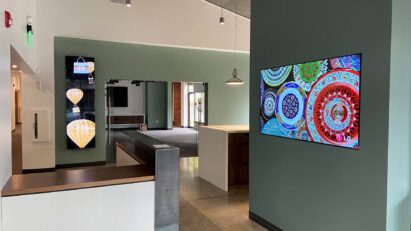 LG Business Solutions' wide range of versatile and cable-less commercial displays fitted around a showroom