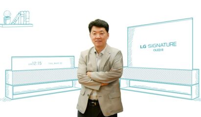 Baek Sun-pil, TV Product Strategy Team Leader, standing in front of two illustrations of LG SIGNATURE OLED R in its Full View and Line View modes