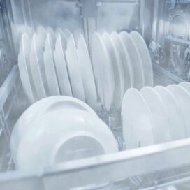 Dishes being washed inside the LG QuadWash™ dishwasher via LG's chemical-free EasyClean™ system