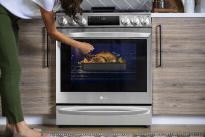 A woman is knocking on the glass window of the oven of InstaView® Range to see inside