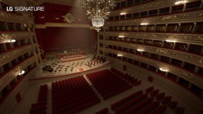 A picture of the stage and empty seating of the La Scala opera house taken from the back of the hall