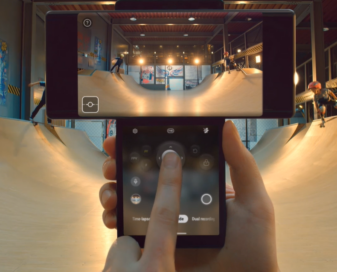 Someone uses LG WING's joystick feature in Swivel Mode to film two kids skateboarding on a vert ramp