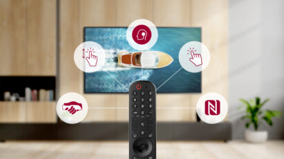 LG’s Magic Remote with icons representing its user-friendly functions for quick and intuitive access to LG webOS 6.0, while an LG TV plays in the background.