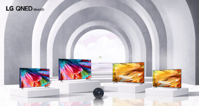 Four TVs from LG's QNED Mini LED lineup standing side by side in a large and modern arched hallway