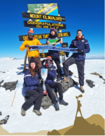 Members of FC Cambounet pose for a group photo at the peak of Mount Kilimanjaro.