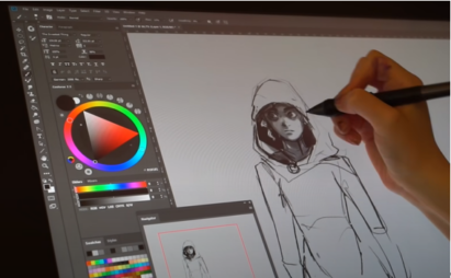 YouTuber Honeyball using an LG UltraGear monitor and sketching software to draw a picture of a character wearing a hoodie.
