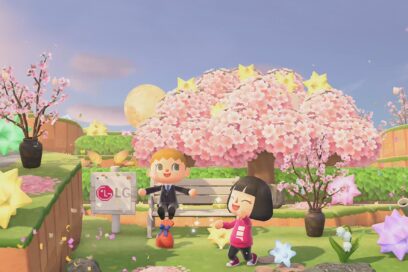Two player avatars on popular Nintendo game 'Animal Crossing’ play around a cherry blossom tree beside a wooden sign displaying the LG logo.
