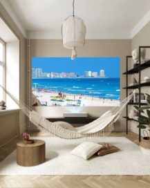 A unique relaxing space at home boasts a hammock and the LG Cine Beam Projector which is displaying clear and vibrant images of a beautiful coastal city on the far wall.