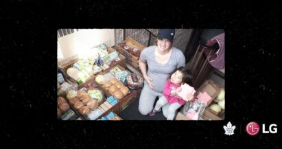 Local hero Janelle Jong and her daughter posing with food that has been donated to help feed hungry people in their community.