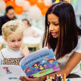 Merissa Forsyth, founder of the Pretty Foundation that encourages girls to feel better about their bodies, reading a book to a young girl.