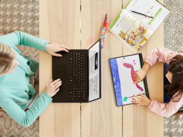 A woman using LG gram to do some work at her desk with her daughter who is drawing a picture of an animal on LG gram 2-in-1.