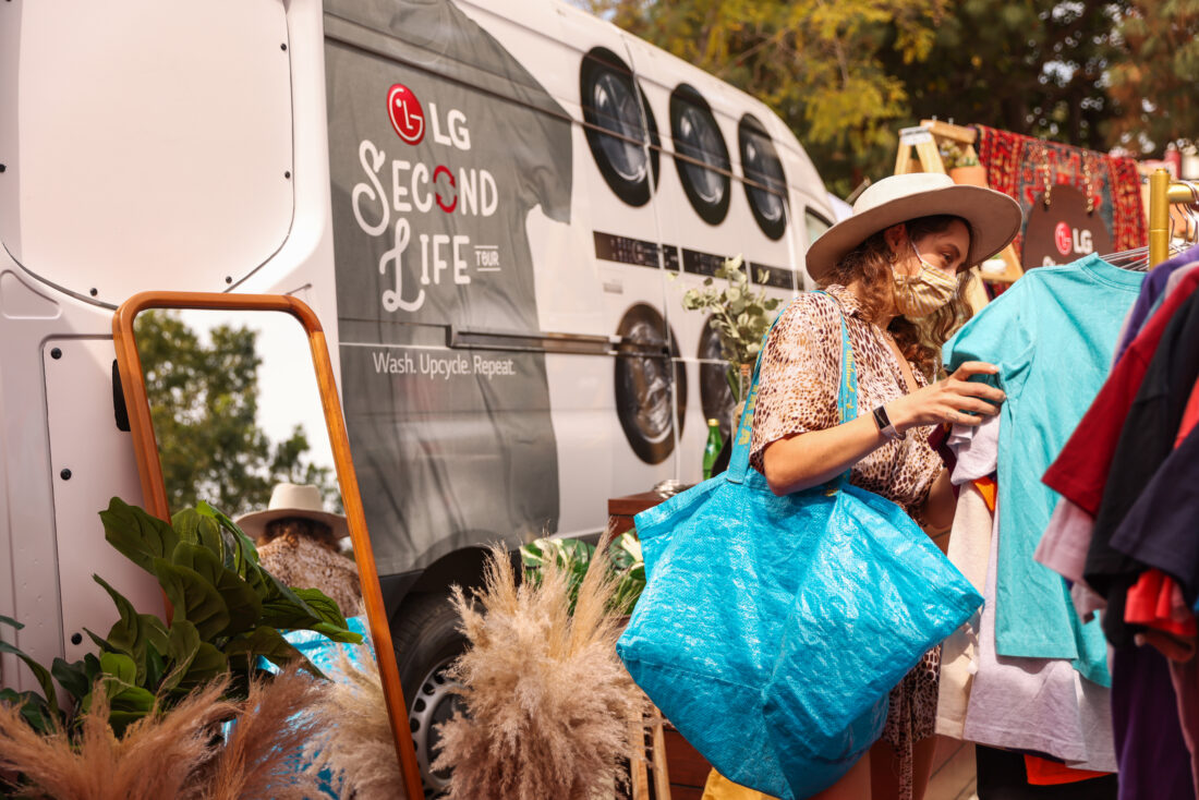 A woman looking through the clothes on display at The Second Life Campaign venue which is being hosted by LG Electronics