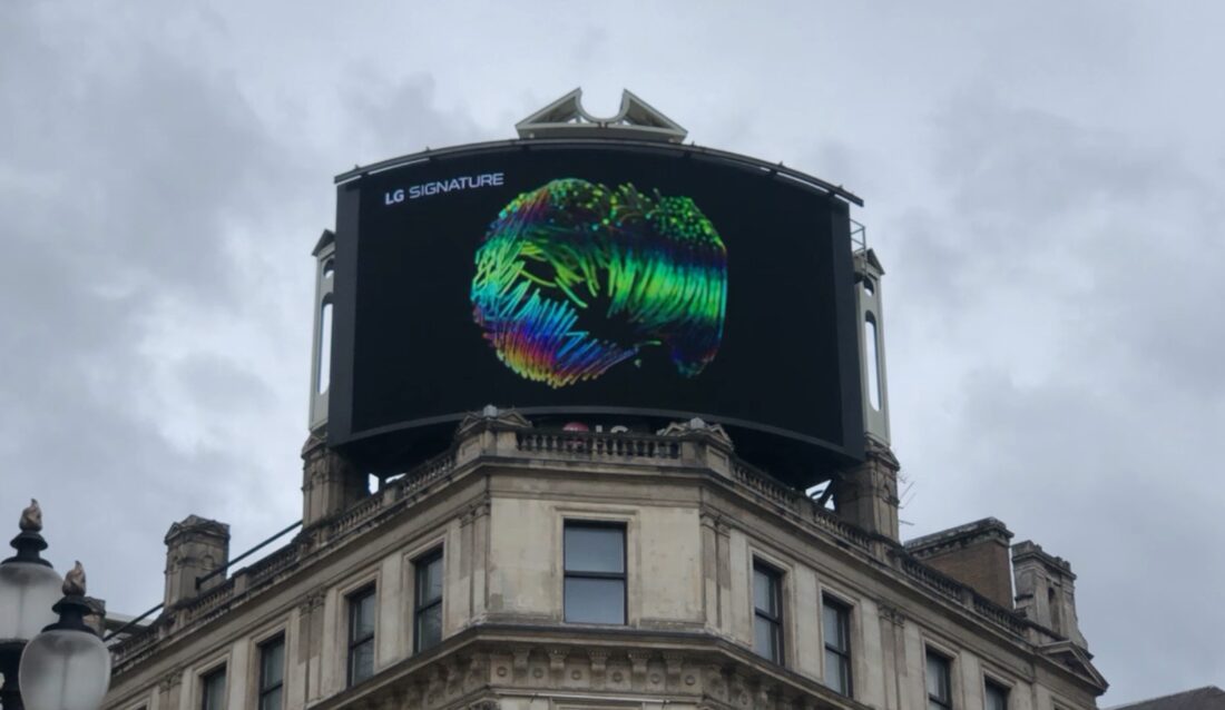 A close-up photo of LG's digital billboard in Piccadilly Circus, London with an animation representing LG SIGNATURE OLED R