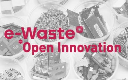 Mechanical parts that have been disassembled from electronic devices with the title ‘e-Waste Open Innovation’