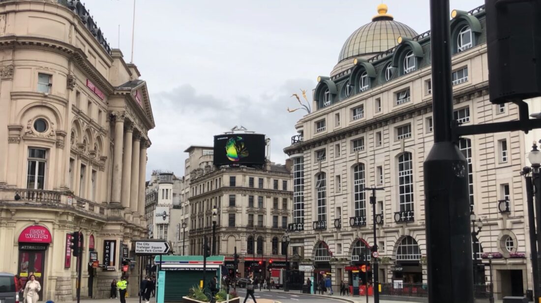 LG's digital billboard in Piccadilly Circus, London displaying an animation representing the function of LG SIGNATURE OLED R