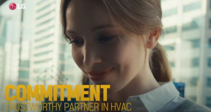 A screenshot from the LG HVAC Solutions YouTube video representing commitment with a woman looking down and smiling