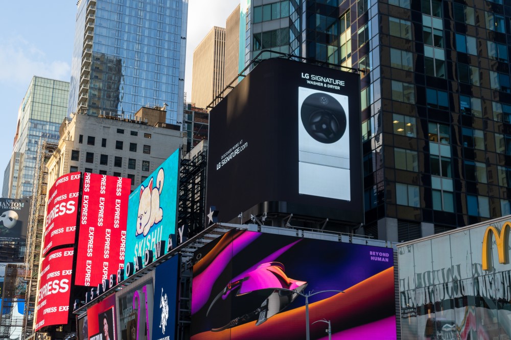 LG's digital billboard in Time Square, New York with an image of LG SIGNATURE Washer and Dryer against a black background