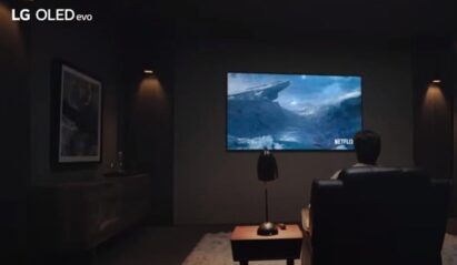 A man watching Netflix in his living room on LG OLED TV