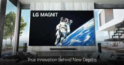 LG MAGNIT hanging on the wall of a modern living room as it displays an astronaut floating in space