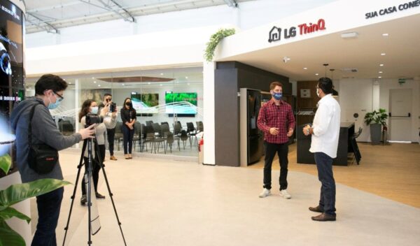 Two men discussing LG ThinQ at The LG Business Solution Center during filming.