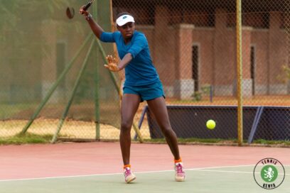 Angela Okutoyi swinging her racket during tennis practice