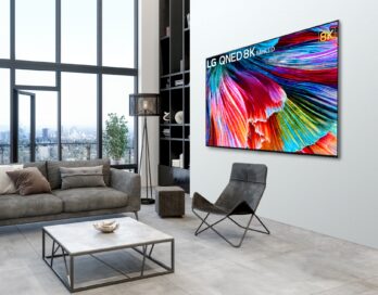 Right-side view of 8K QNED Mini LED TV mounted on the wall of a modern living room