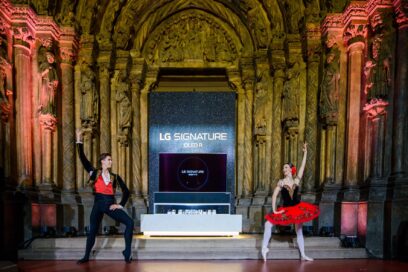 A photo taken during the launch of LG OLED R at the Pushkin Museum with two ballet dancers performing in front of the groundbreaking TV