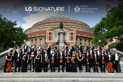 The Royal Philharmonic Orchestra posing outside the Royal Albert Hall with the logos of LG SIGNATURE and the orchestra above