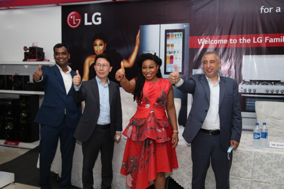Famous Nigerian actress Rita Dominic giving a thumbs up with Kim Dong-yun of LG West Africa and Mohamed Fouani of Fouani Nigeria Limited
