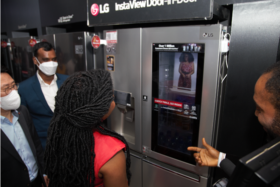 Famous actress Rita Dominic learning about LG’s InstaView Door-in-Door refrigerator at the showroom