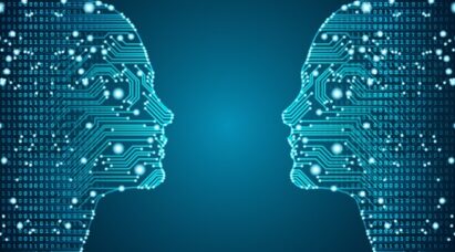 Two circuit patterns resembling two human heads face-to-face to represent artificial intelligence.
