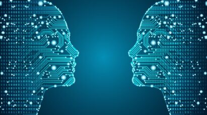 Two circuit patterns resembling two human heads face-to-face to represent artificial intelligence.