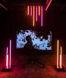 “Ánima” by Fátima Tamayo, which reflects the challenges of growing old, displayed on LG OLED TV with neon lighting surrounding the exhibit