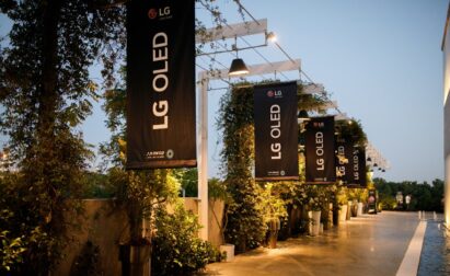 Several promotional banners for LG OLED event hanging outside the venue.