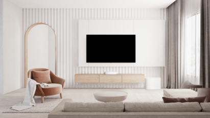 The white LG Éclair and subwoofer placed below a wall-mounted LG TV to effortlessly blend into a white contemporary living room