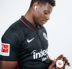 Ragnar Ache, who plays striker for the Bundesliga’s Eintracht Frankfurt football club, posing with the Eintracht Frankfurt TONE Free