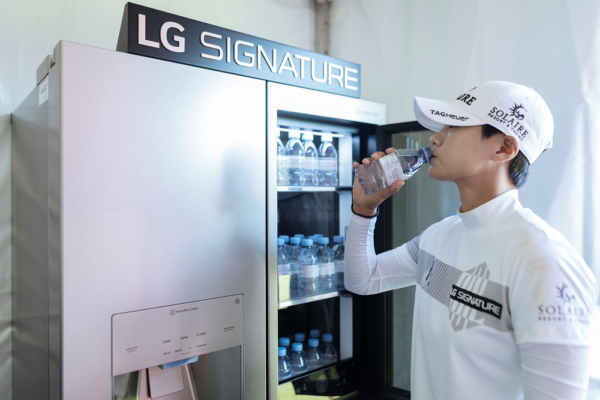 Professional golfer Park Sung-hyun drinking a bottle of water from LG SIGNATURE Refrigerator. 